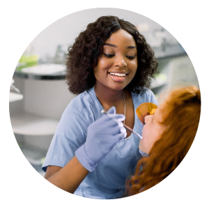 Dentist checking patients mouth.